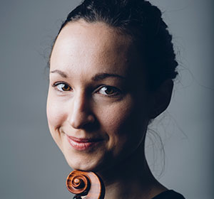 performer posing with their instrument